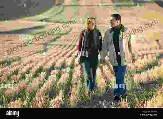A Couple Walking Through A Lush Green Field In The Cotswolds Lonely Planet Pocket Oxford The Cotswolds (Travel Guide)