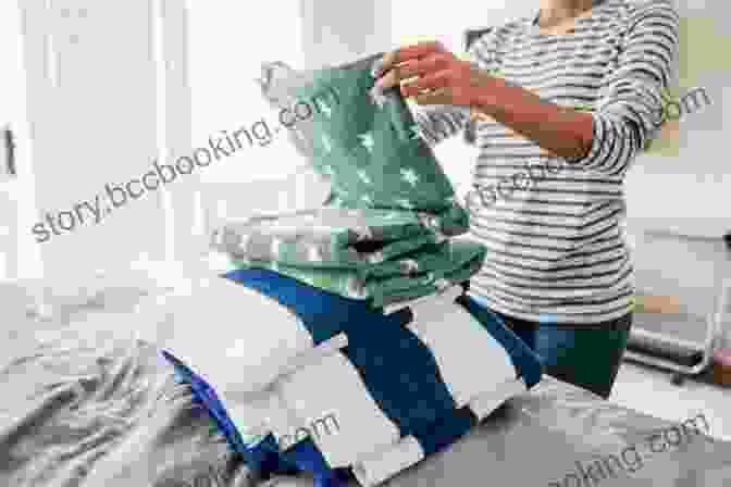 A Smiling Person Folding Laundry In A Bright And Airy Room Laundry Love: Finding Joy In A Common Chore