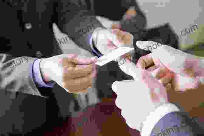 Businesspeople Exchanging Business Cards At A Networking Event Business Etiquette: Become A Professional Business Person
