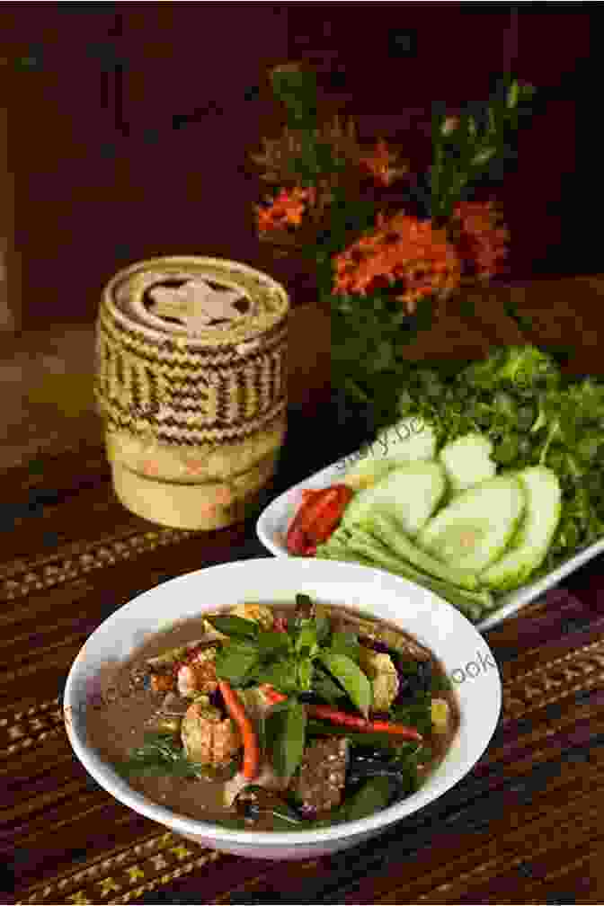 Delicious Spread Of Lao Dishes, Including Sticky Rice, Grilled Meats, And Fresh Vegetables Lonely Planet Laos (Travel Guide)