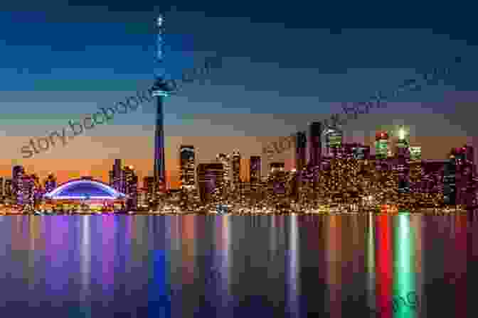 Toronto's Iconic Skyline At Dusk, Featuring The CN Tower, Skyscrapers, And The Glistening Waters Of Lake Ontario, Showcasing The City's Vibrant Energy. Lonely Planet Best Of Canada (Travel Guide)